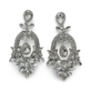 a pair of silver earrings with diamonds