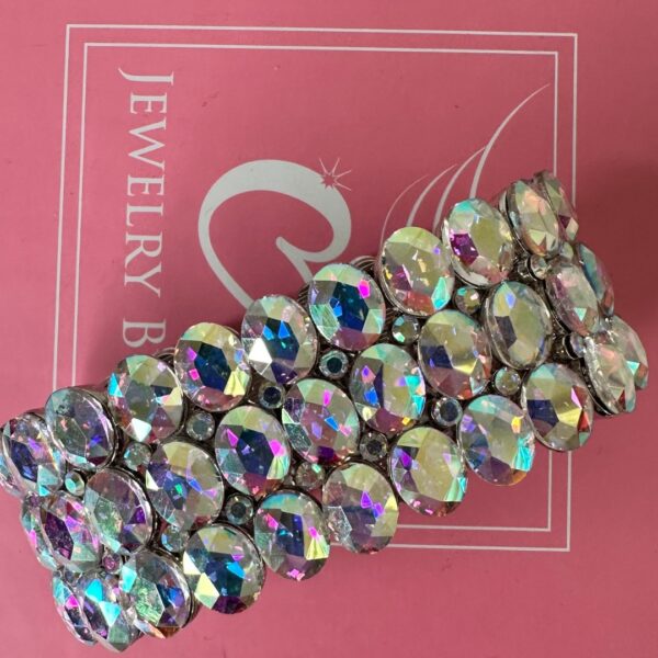 a bracelet on a pink surface