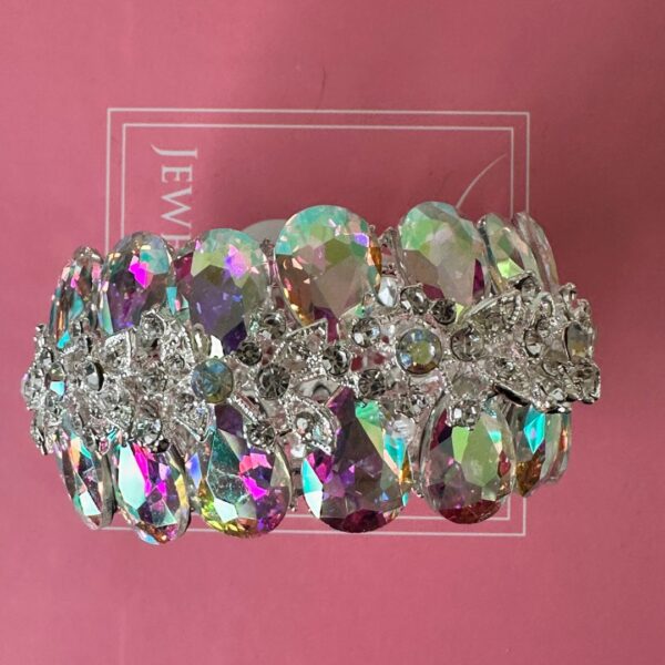 a bracelet on a pink surface